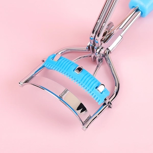 Portable stainless steel eyelash curler with light blue built-in comb for lasting volume