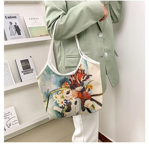 Detail of oil painting canvas tote bag showing artistic print and large capacity