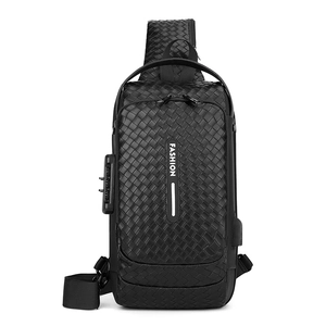 Men's black crossbody chest bag with woven texture, TSA lock, and USB charging port