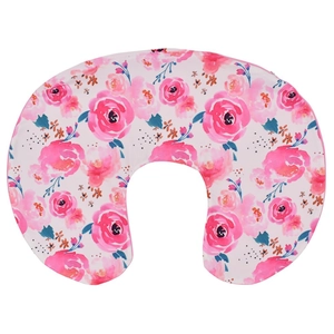 Close-up of nursing pillow cover featuring pink watercolor roses and soft fabric texture