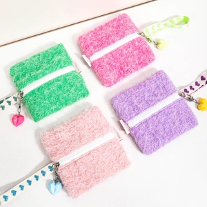 Vibrant fuzzy square coin purses with heart pendants and patterned straps in 4 colors.