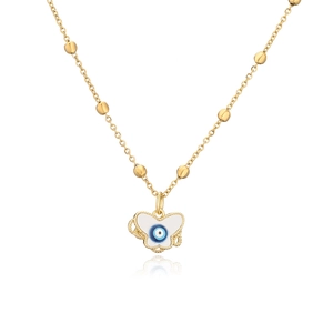 Macro detail of 18K gold plated beaded chain with white enamel butterfly evil eye pendant
