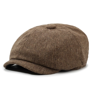 Side view detail of a breathable linen newsboy cap with vintage brown tweed texture