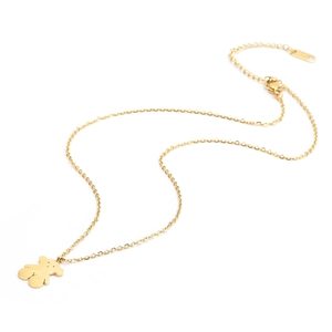 Close-up of golden stainless steel chain with cute bear silhouette pendant on white background