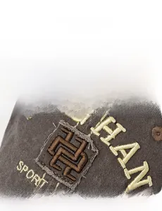 Detail shot of the vintage gray baseball cap featuring premium 3D sport letter embroidery