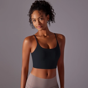 Close-up of black strappy yoga tank top with thin shoulder straps and high-stretch fabric
