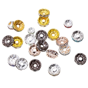 Macro shot of assorted rhinestone spacer beads for DIY jewelry making in multiple finishes