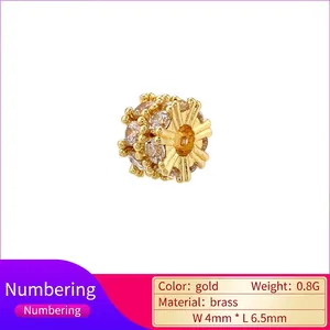 Gold plated brass spacer bead with zircon stones and hollow eye pattern 4x6.5mm