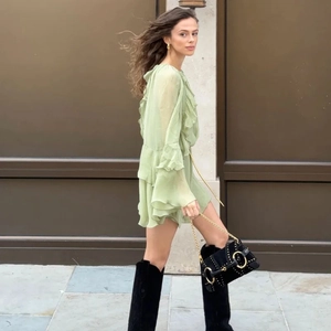 Light green tiered ruffle mini dress with long bell sleeves and high waist design