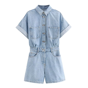 Short sleeve light blue denim jumpsuit with lapel collar and pockets on white background
