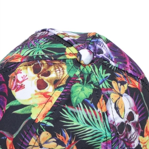 Macro view of tropical skull and leaf print on the crown of the baseball cap