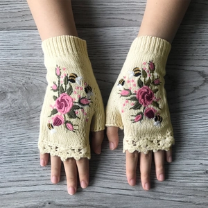 Women's warm knitted fingerless gloves in yellow with rose and bee embroidery
