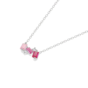 Macro detail of silver necklace featuring gradient pink gems and white cubic zirconia
