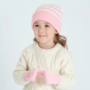 Detail of pink and white striped knit baby hat and mittens with soft wool texture