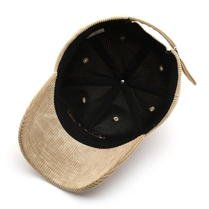 Adjustable khaki corduroy baseball cap showing interior stitching and branded labels