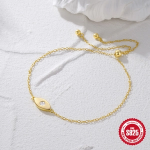 Adjustable S925 sterling silver gold bracelet featuring a devil eye white crystal charm