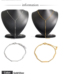 Detailed view of the gold and silver bar-link bracelet set with high metallic sheen
