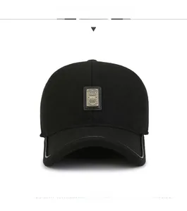 Detailed view of black wool baseball cap with leather logo patch and curved brim