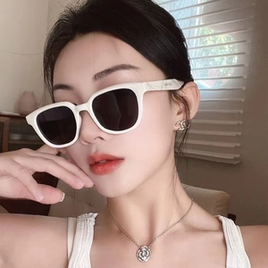 Square grey sunglasses with thick white frames and luxury accessories for women