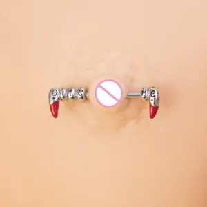 Macro shot of stainless steel nipple barbell featuring red fangs and Bite Me engraving