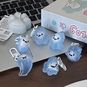 Set of six glowing blue ghost keychains with cartoon expressions for Halloween bags