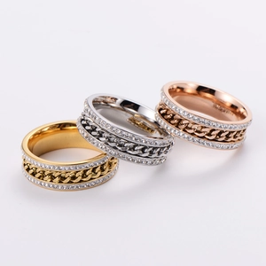 Trio of twist chain rings in gold, silver and rose gold with pavé cubic zirconia