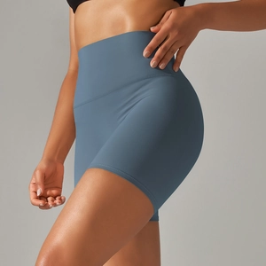 Detail showing high-waist grey blue yoga shorts with seamless elastic waistband for fitness