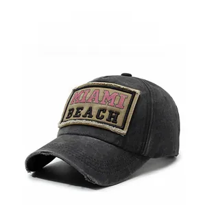 Detail of vintage washed charcoal baseball cap with MIAMI BEACH embroidery and distressed brim