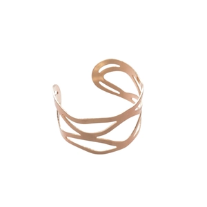Hollow geometric gold metal bracelet with minimalist design on white background