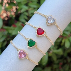 Elegant 18K gold plated heart bracelet with colorful zircon stones on a white stand