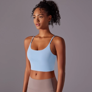 Close-up of light blue yoga crop top with thin straps and smooth elastic fabric