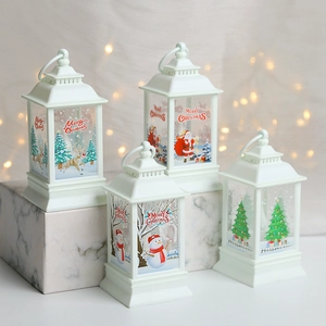 Detailed view of four white Christmas lanterns with Santa, Snowman and Reindeer patterns