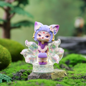 Macro view of purple Nine-Tailed Fox resin figure with iridescent tails on mossy background