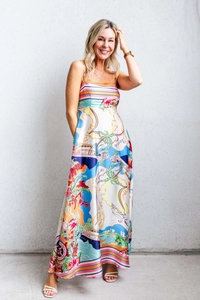 Detail of colorful world map print on a silky maxi dress with nautical and oceania patterns
