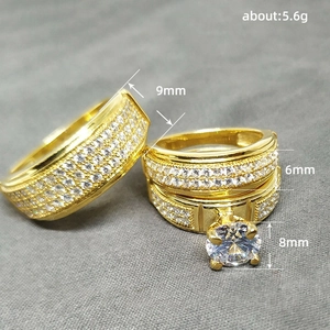 Three-piece gold wedding ring set with cubic zirconia engagement and band rings