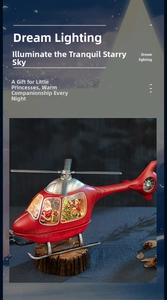 Detail of red helicopter Christmas music box with Santa, snow, and dream lighting