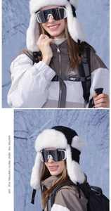 Close-up of thick faux fur trapper hats for skiing with ear flaps and plush texture