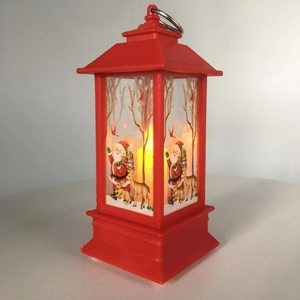 Red Christmas lantern with Santa Claus and reindeer patterns and LED candle inside