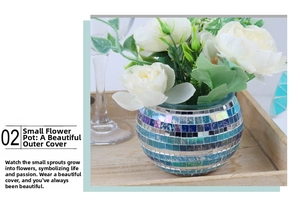 Close-up of mosaic glass candle holder with colorful tiles and white faux roses
