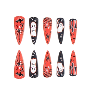 Halloween stiletto false nails with ghost, bat, and spider web patterns in red, black and white