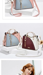 Detailed close-up of color-block handbags with metal ring handles and heart fringe tassels
