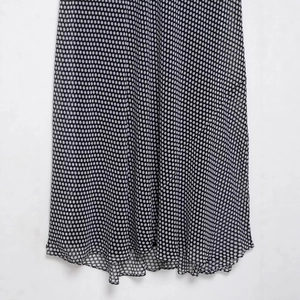 Chic black polka dot vacation dress with backless cowl neck and asymmetric hemline