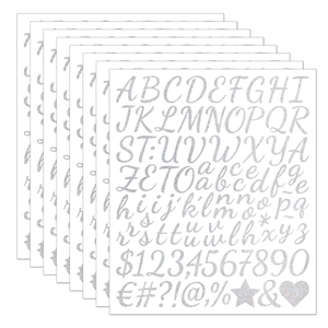 Macro shot of 8 sheets of silver glitter letter and number stickers for DIY crafts