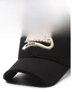 Detail of 3D embroidered Fumay REALIZE text on premium black cotton baseball cap