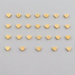 Set of 26 gold heart-shaped metal alphabet beads with letters A to Z for jewelry making