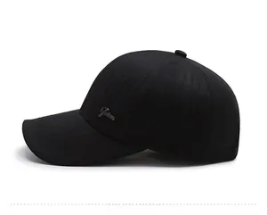 Detail of a black baseball cap featuring a metal 'Fashion' logo on the side panel