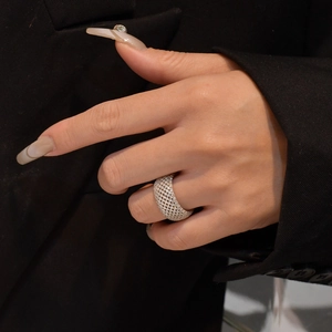 Wide silver mesh ring with full pavé cubic zirconia inlay worn on finger