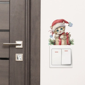 Detailed close-up of a Christmas cat wall sticker applied above a light switch plate