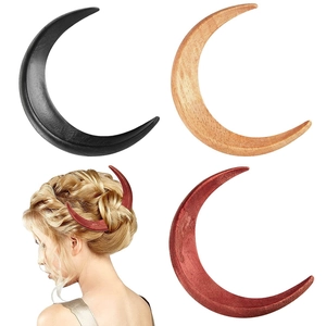 Three crescent moon hair forks in black, light and red brown wood shown with model style
