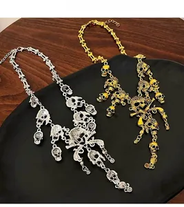 Detail view of punk style gold and silver skull fringe necklaces for Halloween accessories
